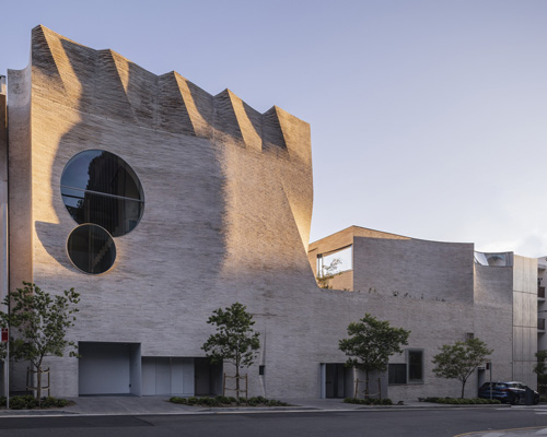 curved brick façade links gallery, performance hall + garden in sydney's phoenix central park