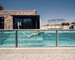 polyergo's summer house sits on a steep slope on the island of crete, greece