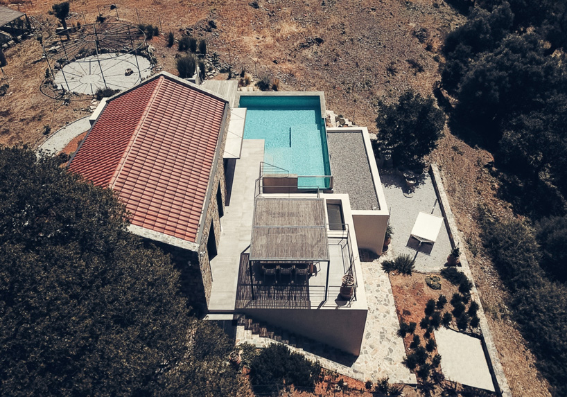 polyergo's summer house sits on a steep slope on the island of crete, greece