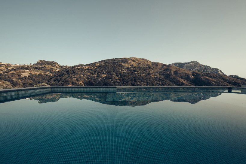 polyergo's summer house sits on a steep slope on the island of crete, greece