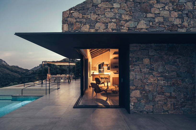 polyergo's summer house sits on a steep slope on the island of crete, greece