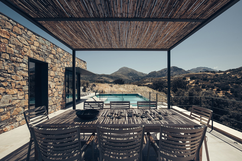polyergo's summer house sits on a steep slope on the island of crete, greece