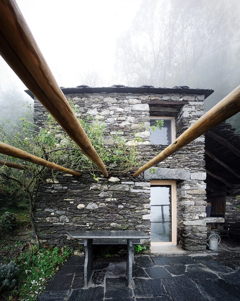 studio inebi renovates 1950's 'calascino' summer house in switzerland