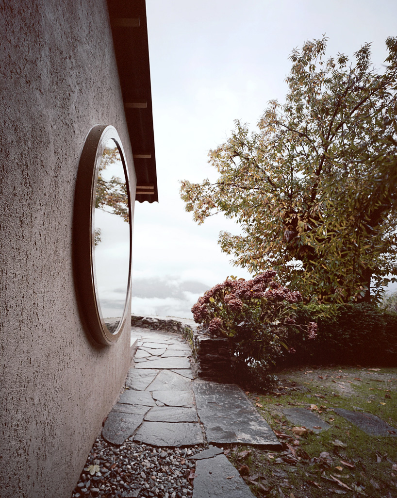 studio inebi renovates 1950's 'calascino' summer house in switzerland