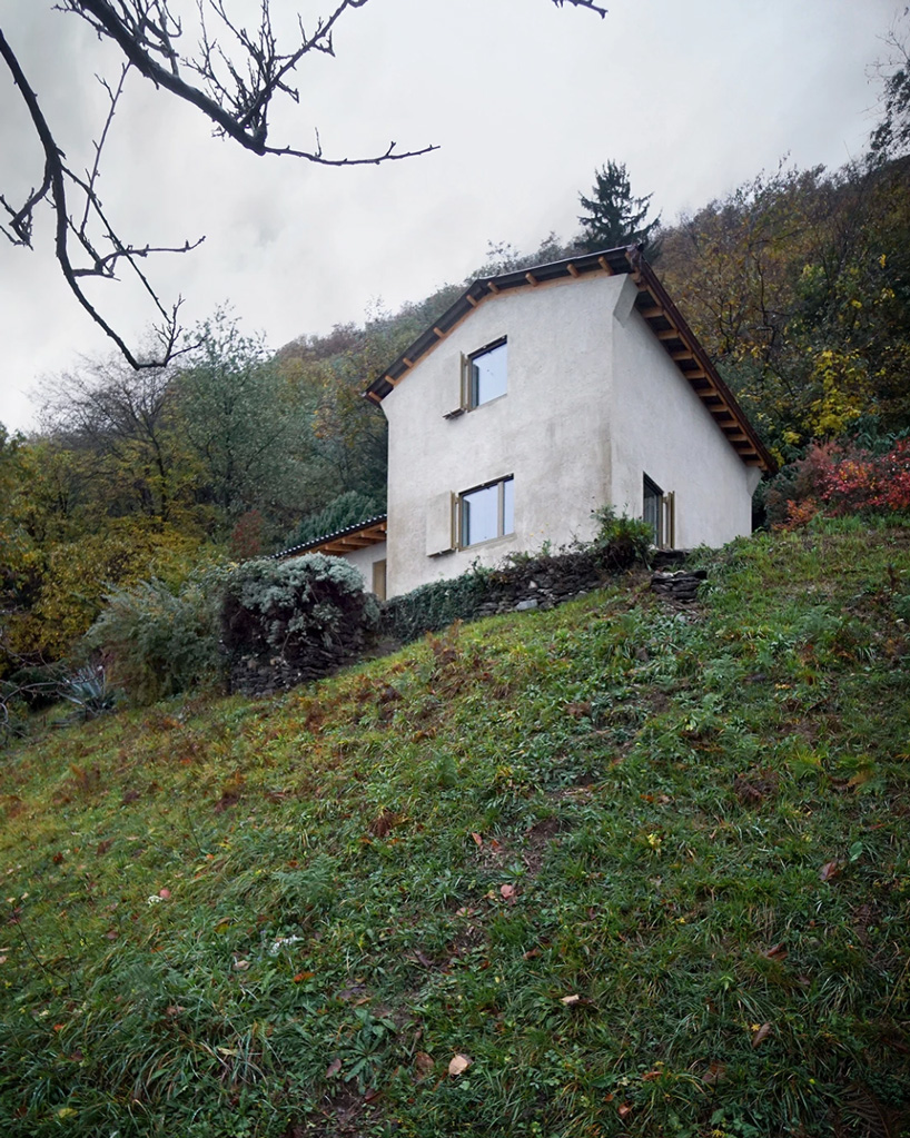 studio inebi renovates 1950's 'calascino' summer house in switzerland