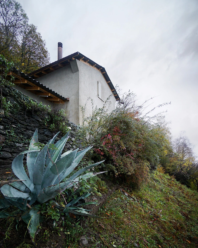 studio inebi renovates 1950's 'calascino' summer house in switzerland