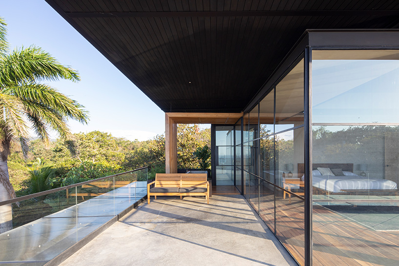 studio saxe clads 'tres amores' house in costa rica with charred timber façades