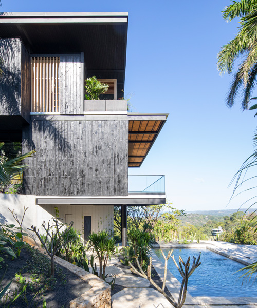 studio saxe clads 'tres amores' house in costa rica with charred timber façades