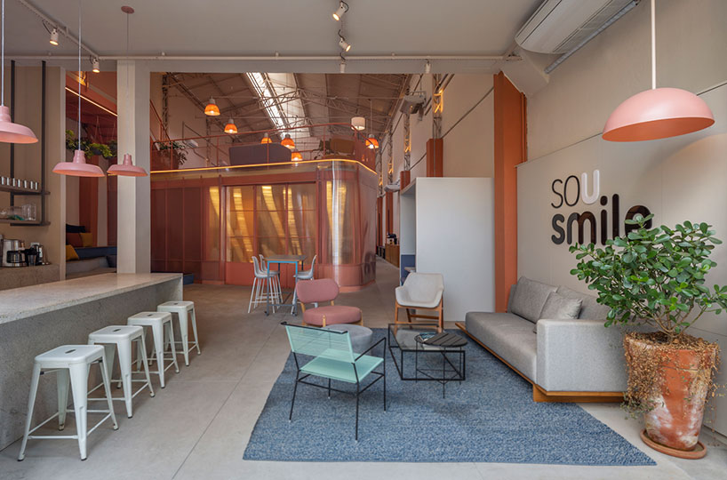 Colorful Booths + Mezzanine Balconies Form Office Space For Dental 