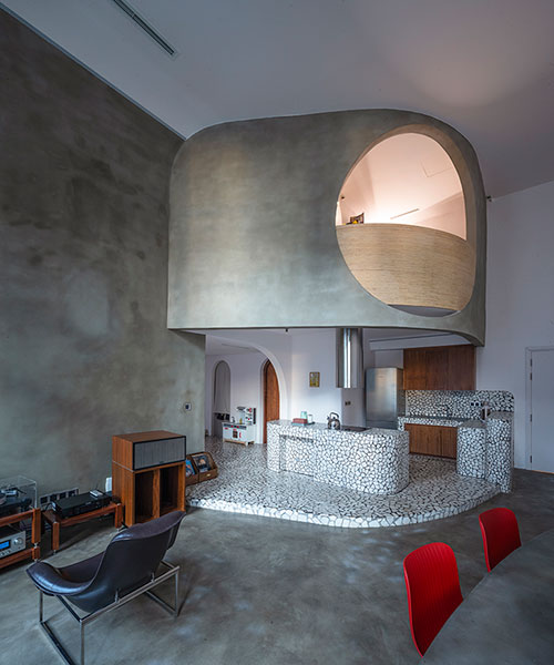 terrazzo sections + curved corners complete modernist apartment interior in vietnam