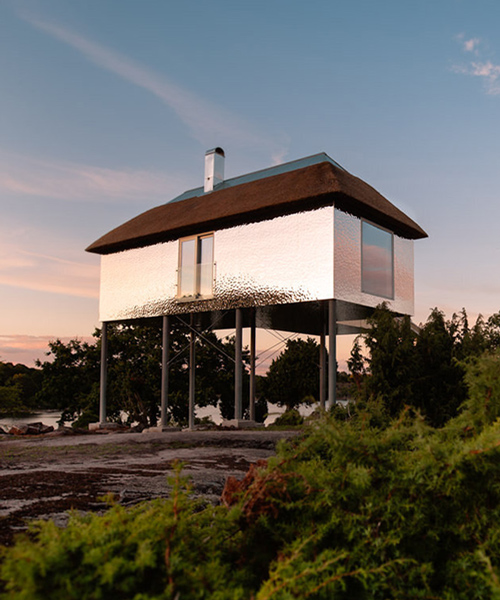 SynVillan is an elevated, mirrored villa at scandinavia's largest safari park