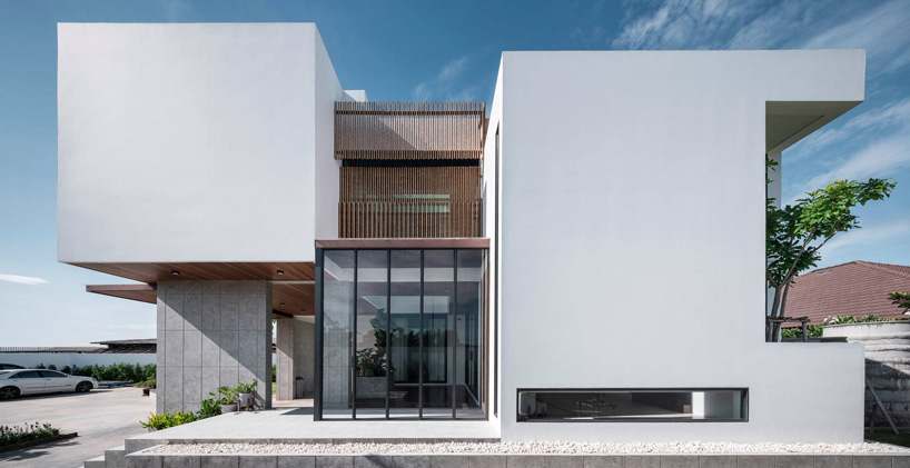 TOUCH architect inserts glass voids for growing trees in the 'stack-cube' house in thailand