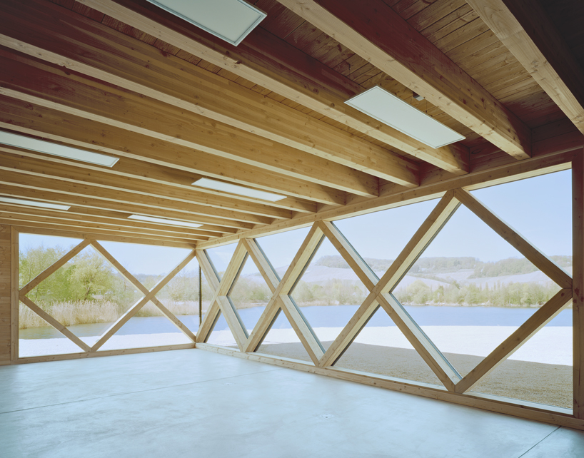longhouse-inspired 'biodiversum' visitor center blends into a nature reserve in luxembourg
