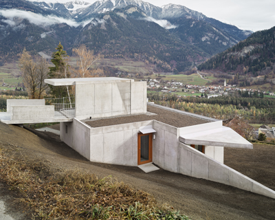 exposed concrete surfaces form this swiss house by angela deuber architects
