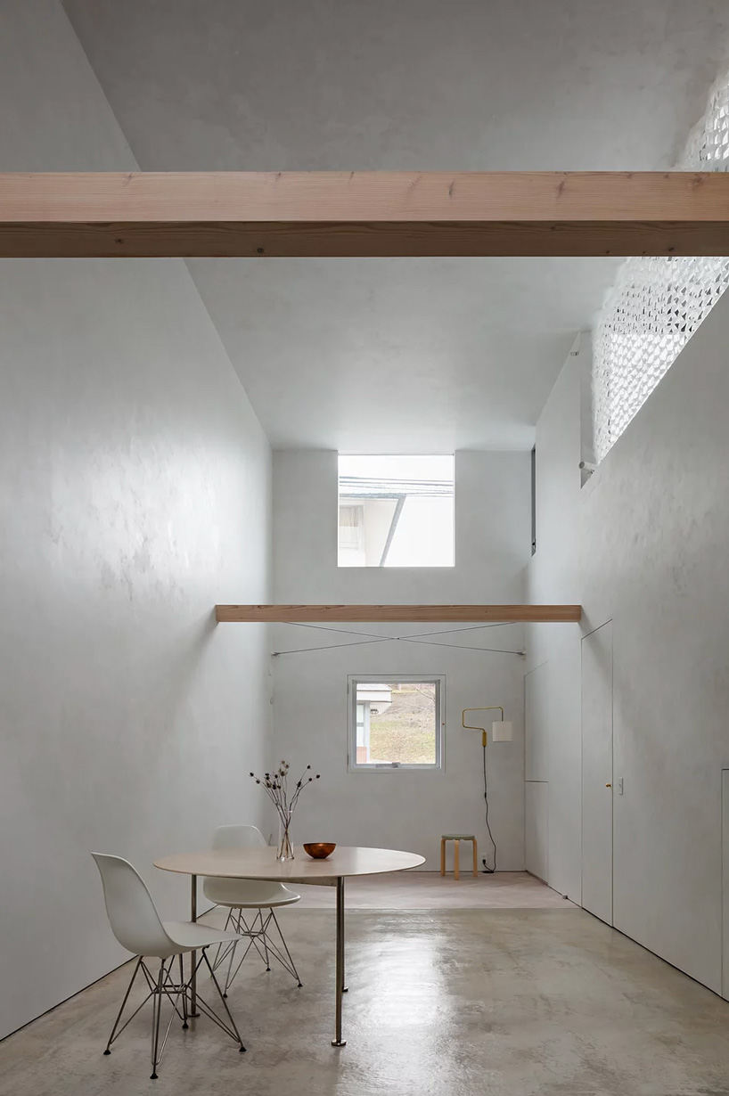 atelierco architects splits 'brass house' in tokyo in two symmetrical halves