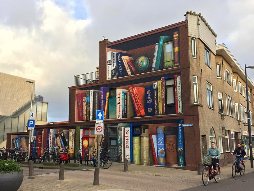 dutch street artist paints a massive bookcase on a three-level building in utrecht