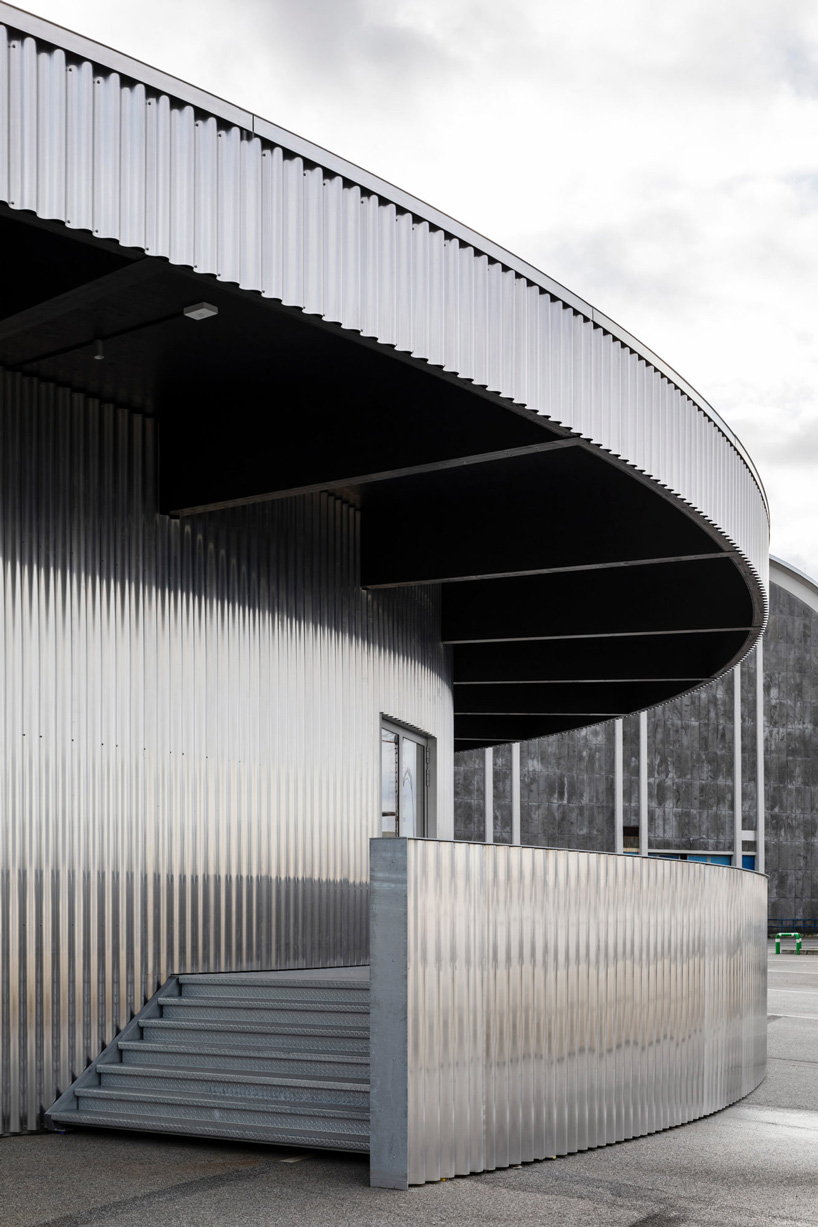 stairs leading to a circular platform under the pavilion's canopy