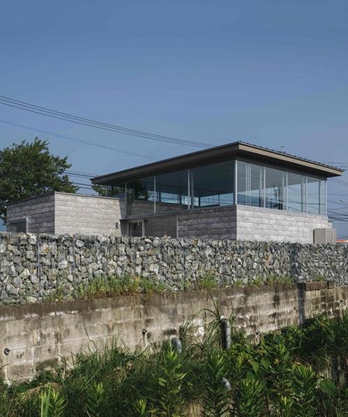 concrete, steel & broken stones form family residence by peak studio in iizuka, japan