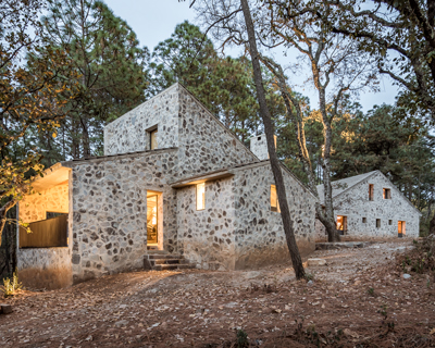COA arquitectura's cozy stone DSA dwellings are huddled among the woods of jalisco