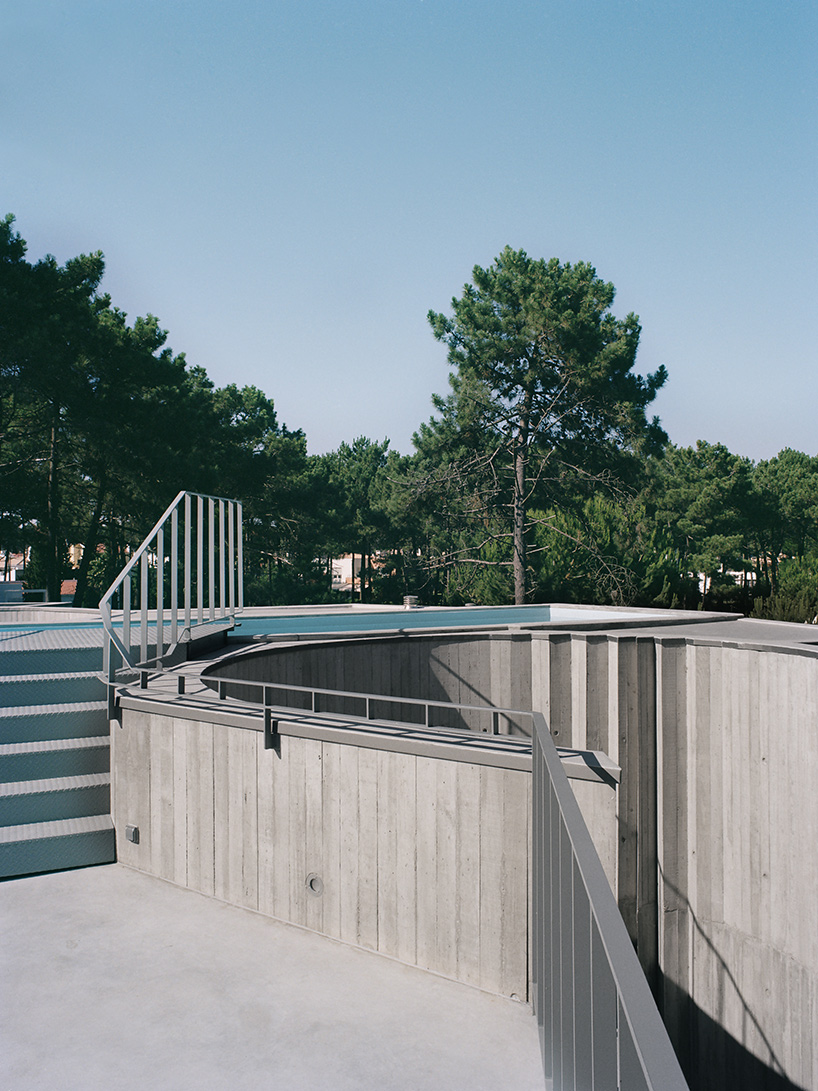 'trefoil house' in portugal by double (o) studio supports a rooftop lap pool
