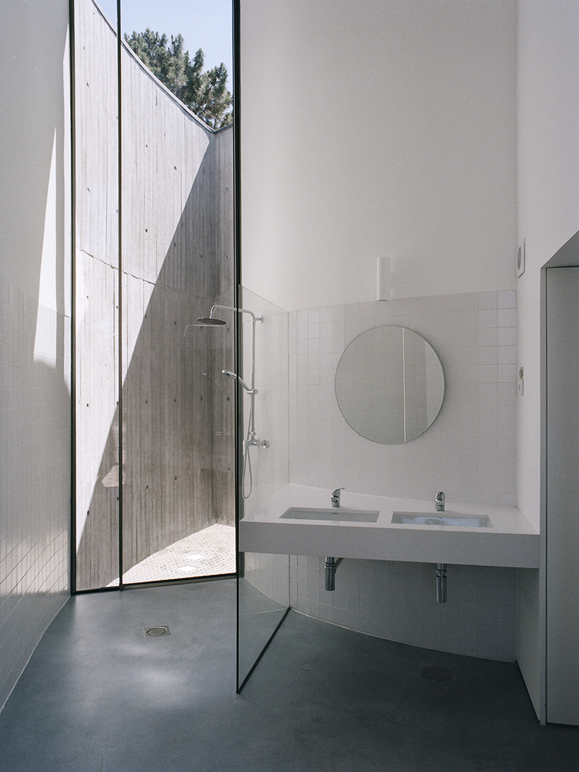 'trefoil house' in portugal by double (o) studio supports a rooftop lap pool