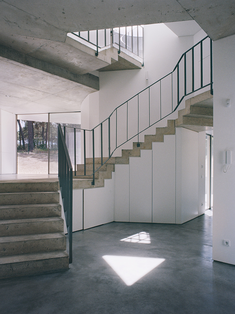 'trefoil house' in portugal by double (o) studio supports rooftop pool