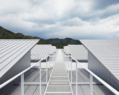eight steel roofs with different textures top factory in japan by kenzo makino & associates