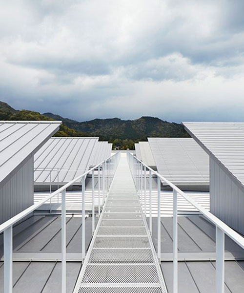 eight steel roofs with different textures top factory in japan by kenzo makino & associates