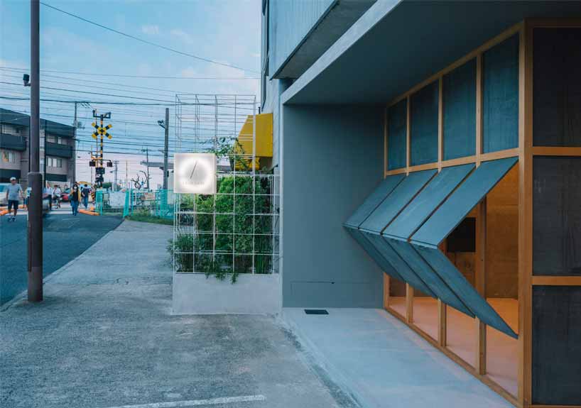 fathom clads japanese hair salon in façade of galvanized iron folding screens