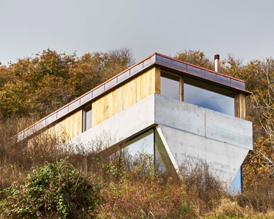 federico rella's concrete + timber house overlooks the mountainous landscape of lugano