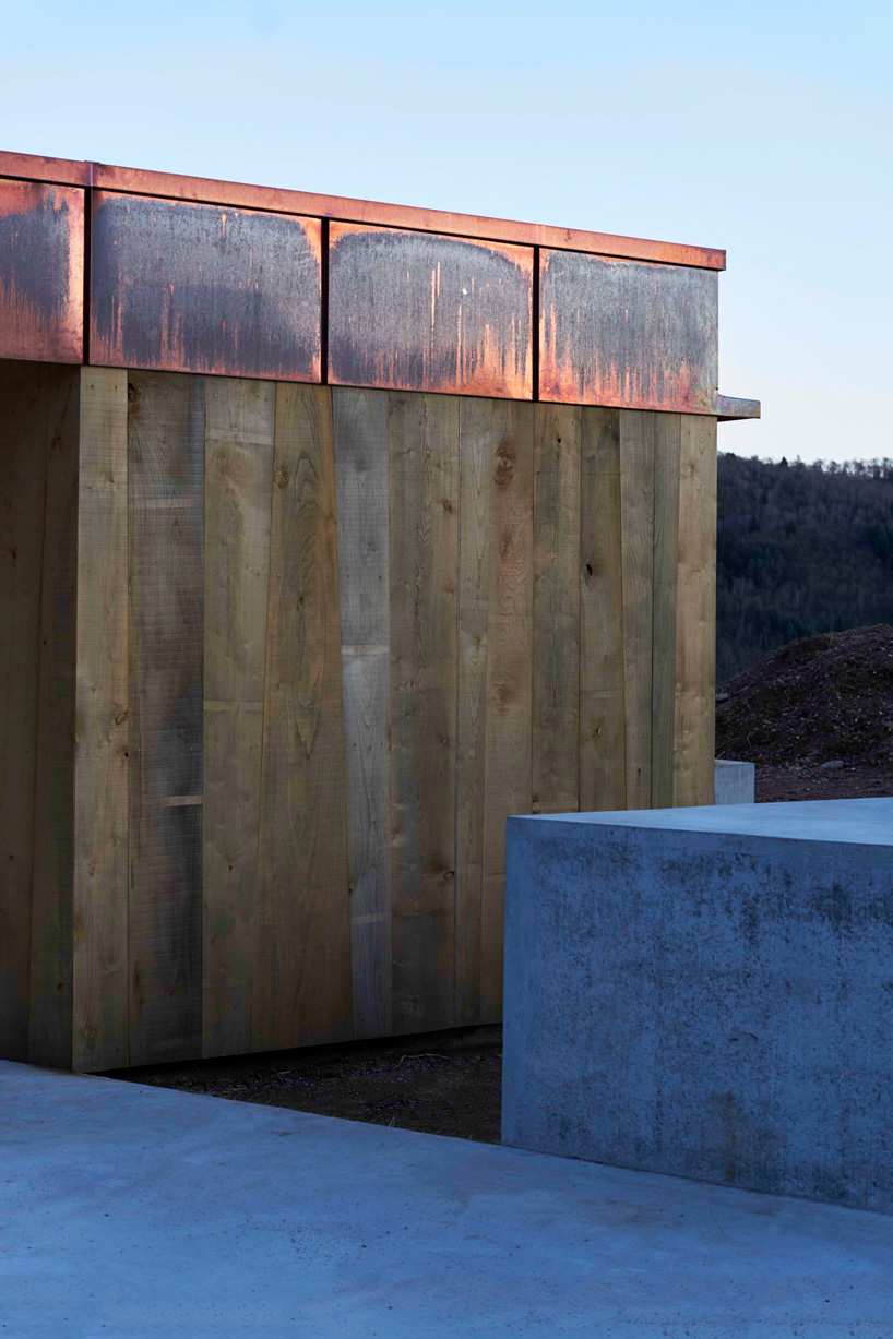 federico rella's concrete + timber house overlooks the mountainous landscape of lugano