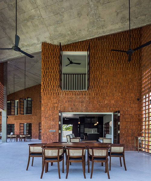 a porous brick façade surrounds G8A's 'tropical chalet' in da nang, vietnam