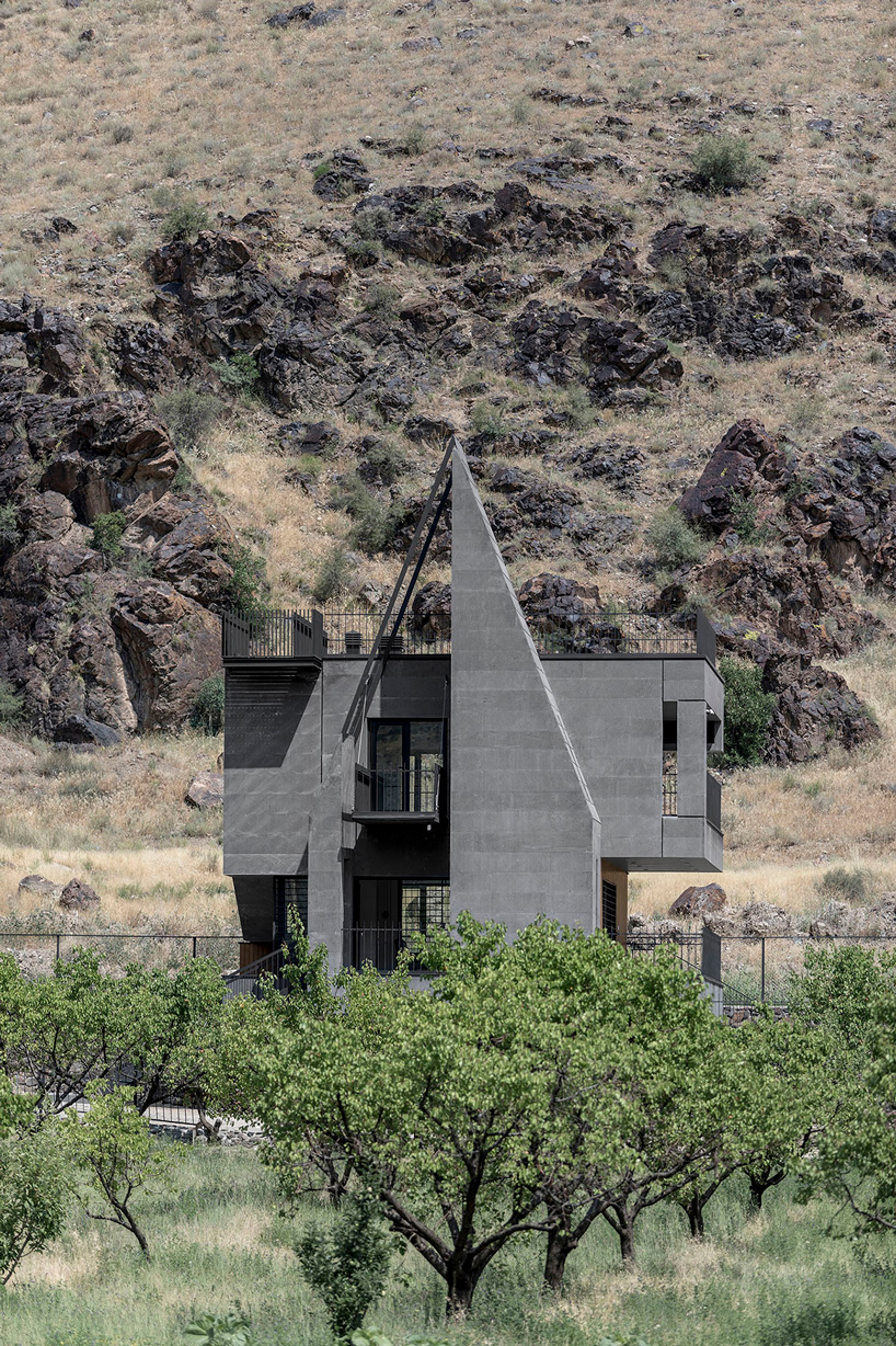exterior view of the monumental building against the mountain background
