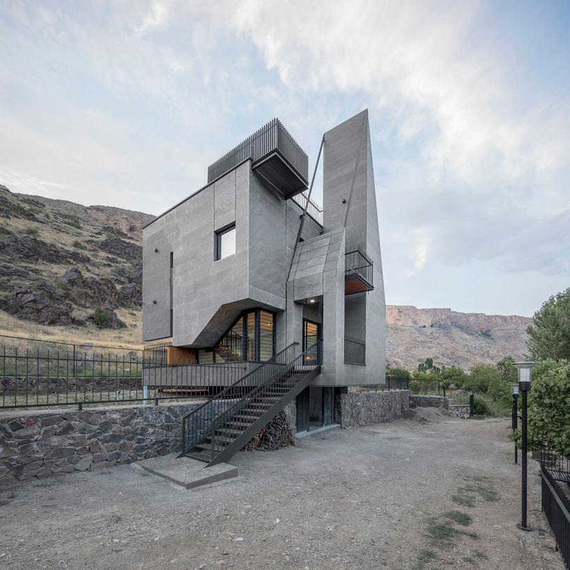 'gray villa' by white cube atelier draws from iran's 's irregular rocks + mountains