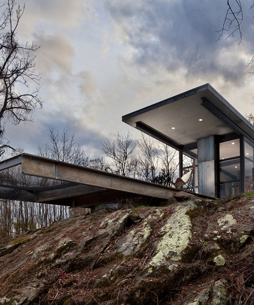 cantilevered hammock completes the off-grid 'lost whiskey' cabin by greenspur in the US