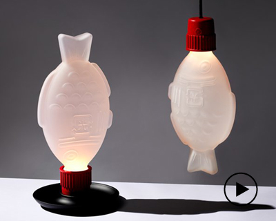 glass lamps shaped like soy sauce packets make a statement on single-use plastic