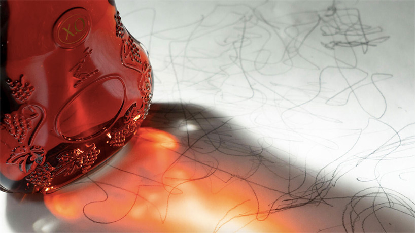 frank gehry designs sculptural gold bottle for hennessy X.O's 150th anniversary