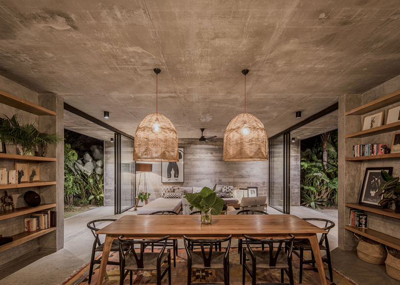 caceres + tous sets exposed concrete 'house BK' amid bali's lush natural landscape