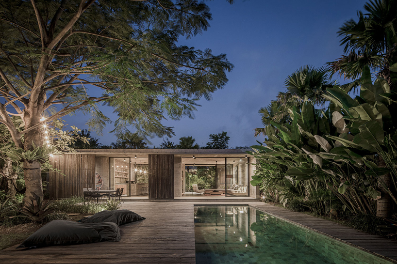 caceres + tous sets exposed concrete 'house BK' amid bali's lush natural landscape