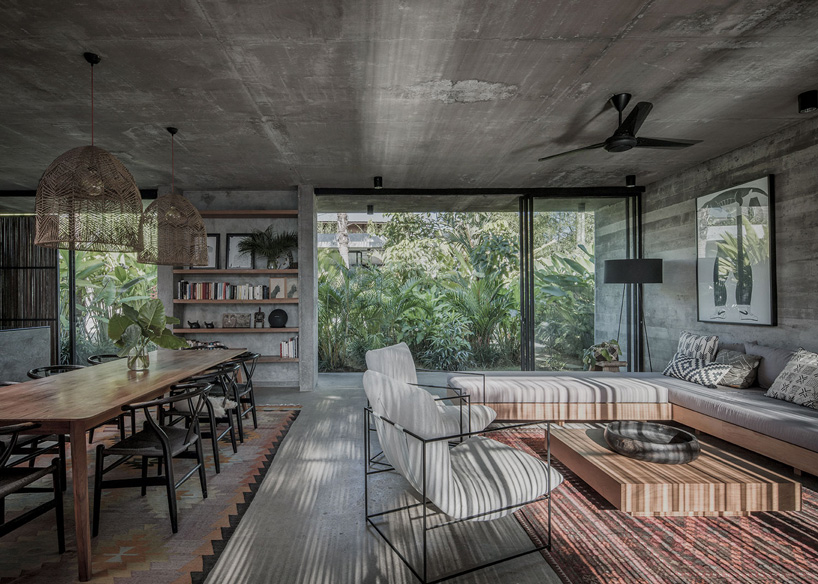 caceres + tous sets exposed concrete 'house BK' amid bali's lush natural landscape