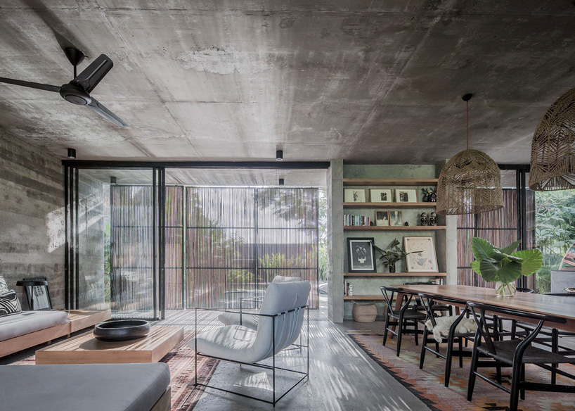caceres + tous sets exposed concrete 'house BK' amid bali's lush natural landscape