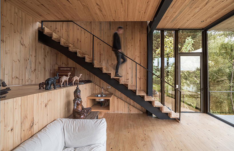 hsu-rudolphy arquitectos embeds 'slope house' into the banks of chile's rapel lake