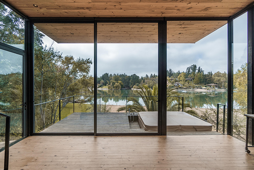 hsu-rudolphy arquitectos embeds 'slope house' into the banks of chile's rapel lake