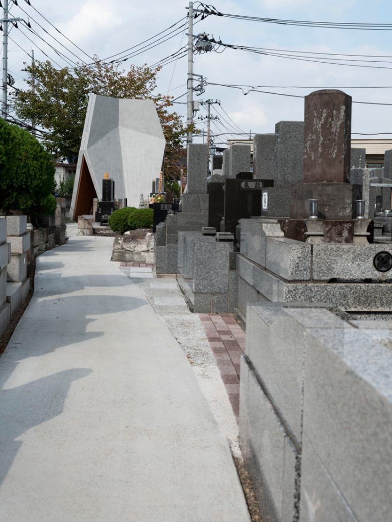 love architecture adds concrete + wood hall for tree burials to new