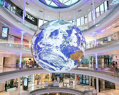 luke jerram + tetro put parisian shopping mall into orbit with globe installation