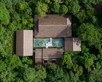 mango bay resort's rammed earth spa by P.I architects is tucked away in a vietnamese forest