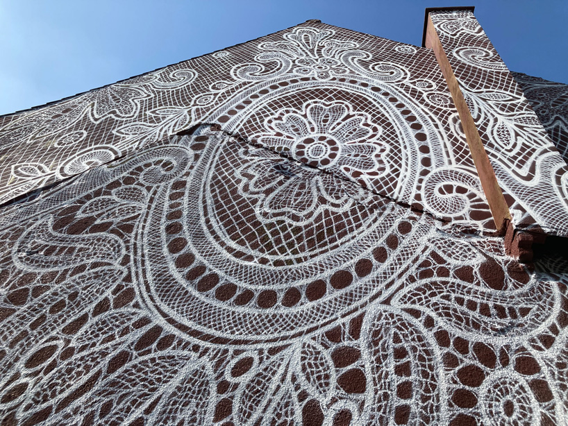 nespoon's giant lace mural in calais, france, pays tribute to the city's unique history
