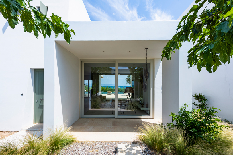 react architects forms two houses along meandering paths in paros