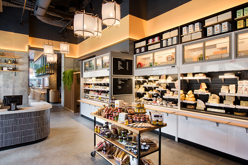 rockwell group designs library-like murray's cheese shop & cheese bar in long island