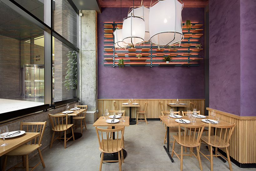 rockwell group designs library-like murray's cheese shop & cheese bar in long island